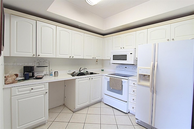 kitchen featuring sink, white appliances, white cabinetry, and light tile patterned flooring