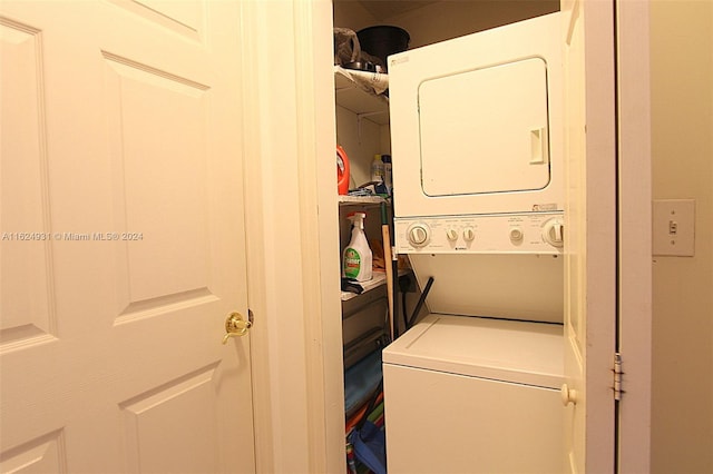 laundry room with stacked washer and clothes dryer