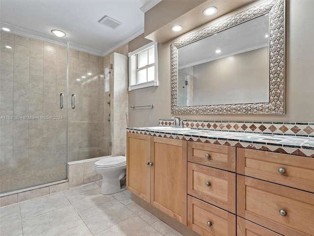 bathroom with toilet, tile patterned flooring, ornamental molding, an enclosed shower, and vanity