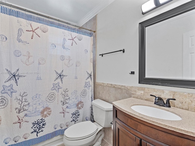 bathroom featuring toilet, tile walls, vanity, crown molding, and a shower with shower curtain