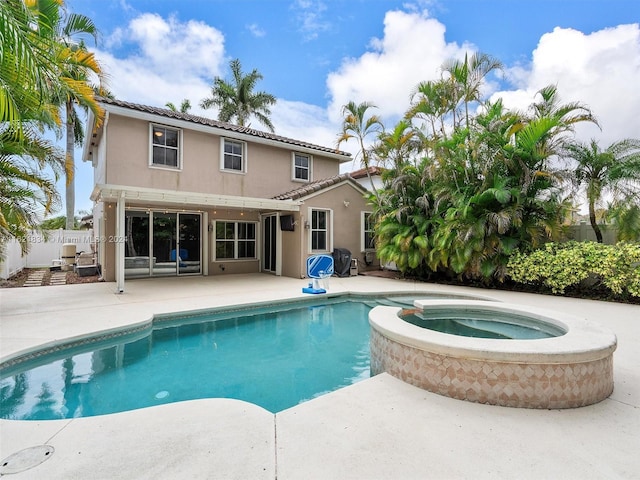 view of swimming pool featuring a patio, area for grilling, and an in ground hot tub