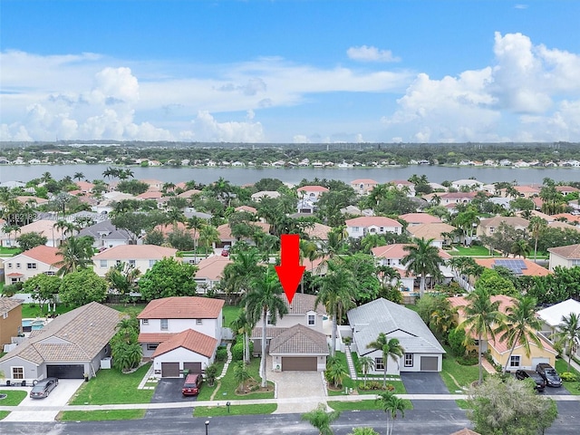 drone / aerial view with a water view