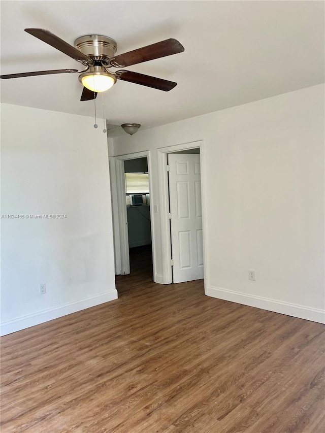 unfurnished bedroom with ceiling fan and hardwood / wood-style floors