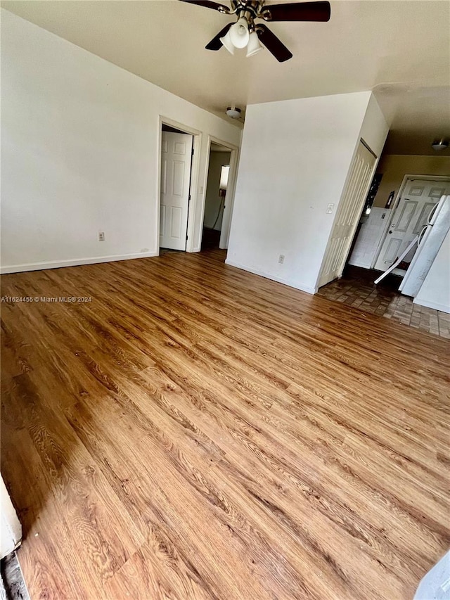 interior space with ceiling fan and hardwood / wood-style floors