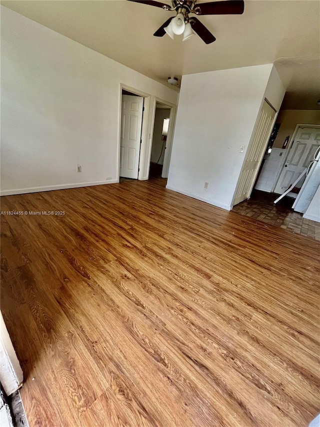 unfurnished living room featuring light hardwood / wood-style floors and ceiling fan