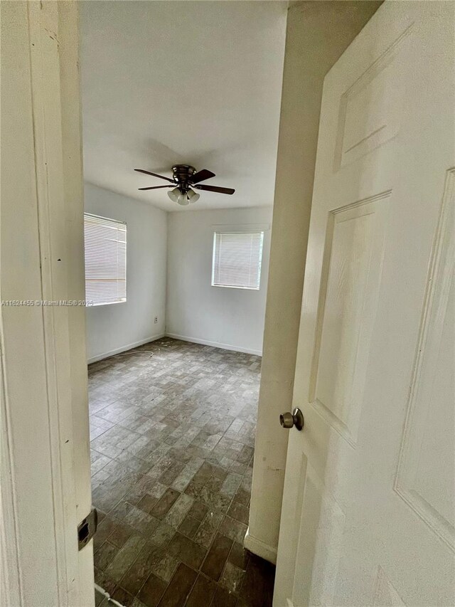 bathroom featuring tile patterned floors, tiled shower / bath, and toilet