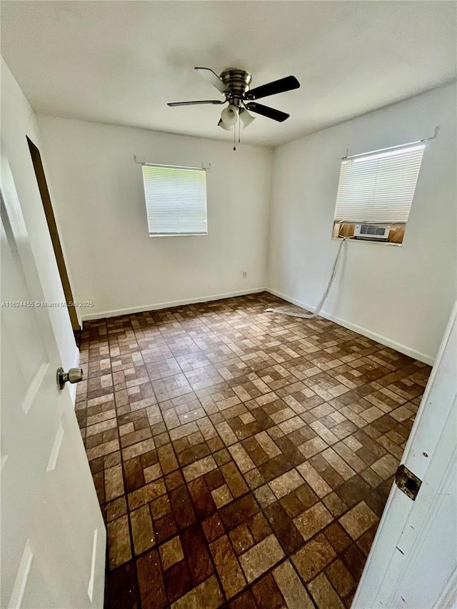 unfurnished bedroom featuring ceiling fan