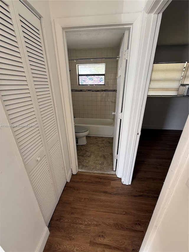 hall with dark hardwood / wood-style floors