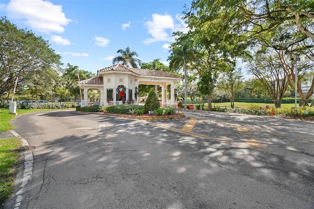 1000 Saint Charles Pl Unit 522, Pembroke Pines, FL 33026 - view of front of home with asphalt driveway, a tile roof, and stucco siding