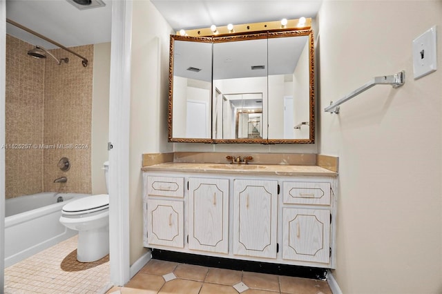 full bathroom with toilet, vanity, tiled shower / bath combo, and tile patterned floors