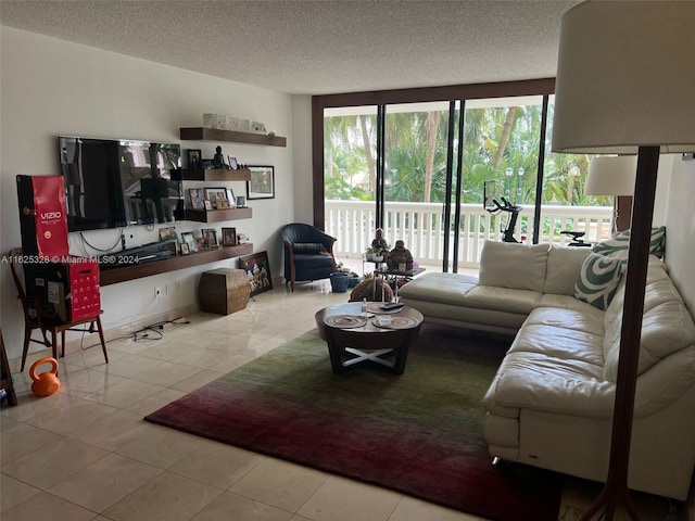 living room featuring light tile patterned flooring and a textured ceiling