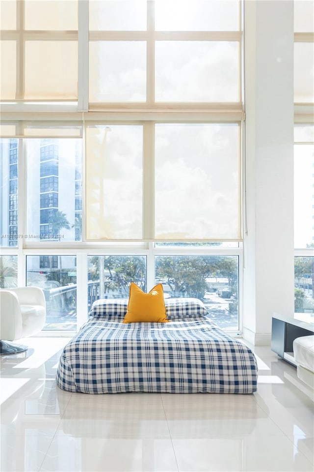 sitting room with light tile patterned flooring and plenty of natural light