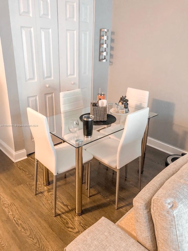 dining space featuring hardwood / wood-style flooring