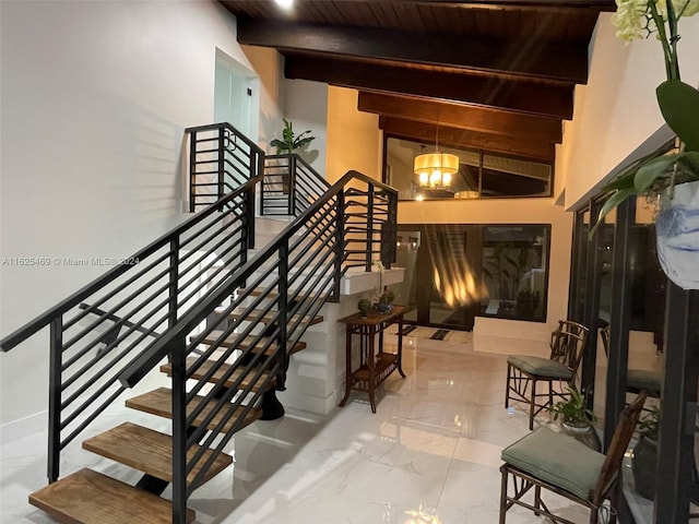 staircase with beam ceiling and wooden ceiling