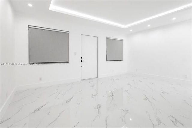 spare room featuring light tile patterned floors