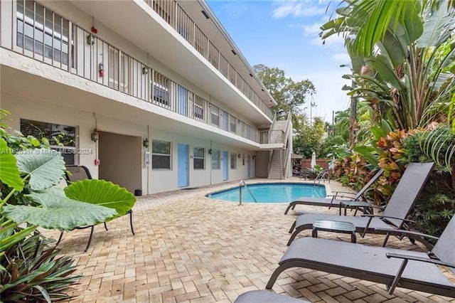 view of swimming pool with a patio area