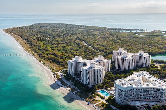 birds eye view of property with a view of the beach and a water view