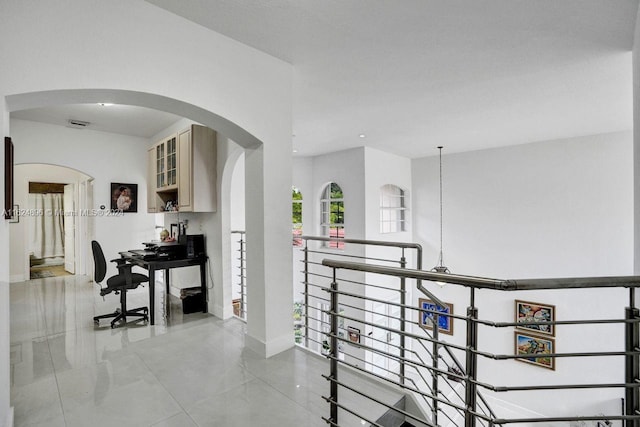 hallway featuring tile patterned flooring