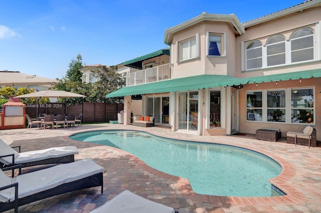 view of pool featuring a patio area