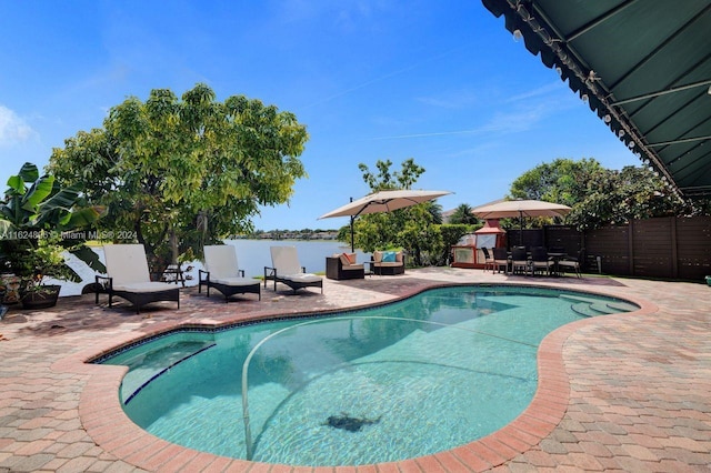 view of swimming pool with a patio area