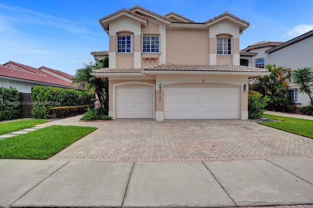 mediterranean / spanish-style house featuring a garage