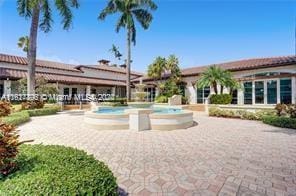 view of pool with a jacuzzi