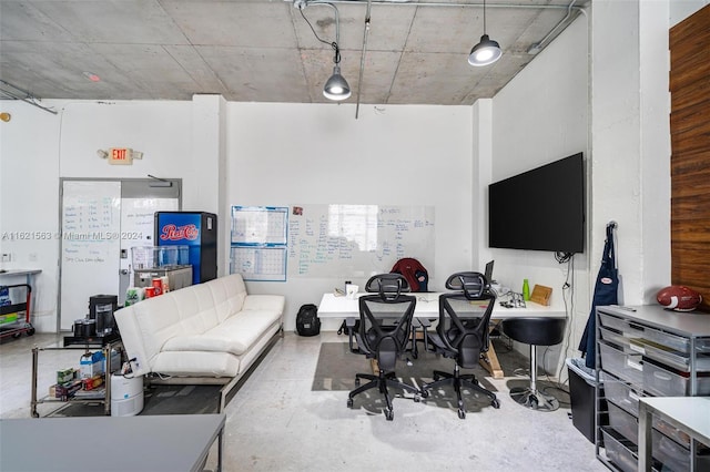 living room featuring concrete flooring