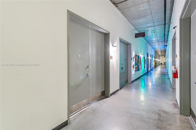 hallway featuring concrete flooring