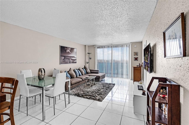 tiled living room featuring a textured ceiling