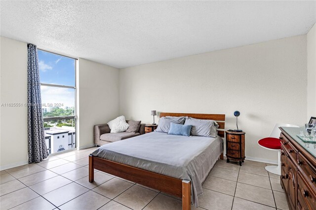 tiled bedroom with a textured ceiling