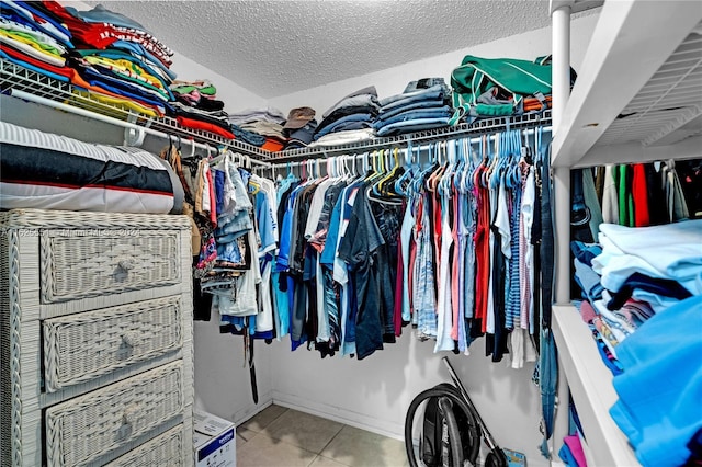 walk in closet featuring tile patterned floors