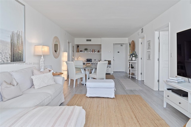 living room with light hardwood / wood-style floors