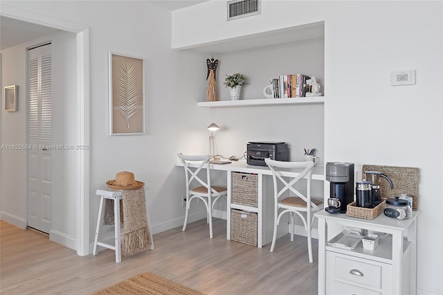 home office featuring light hardwood / wood-style floors