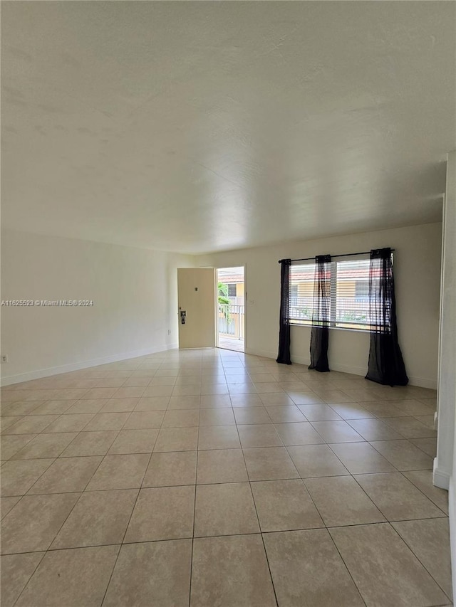 view of tiled spare room