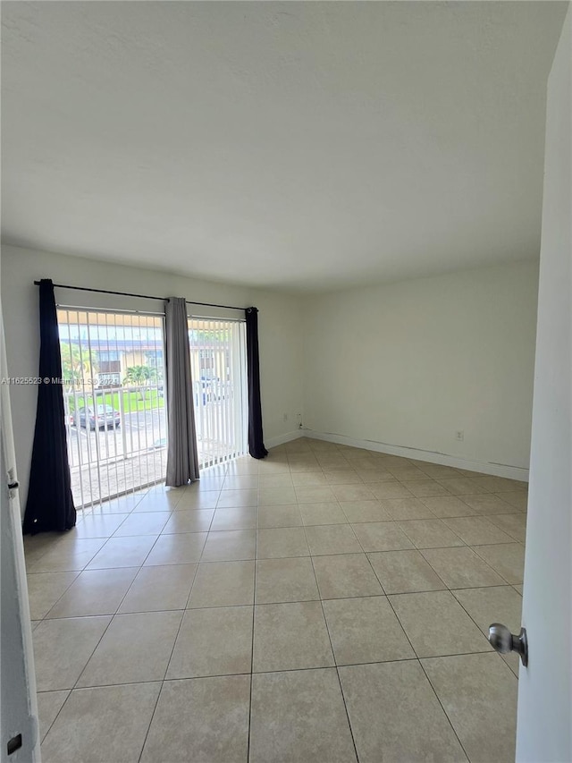 empty room with light tile patterned floors