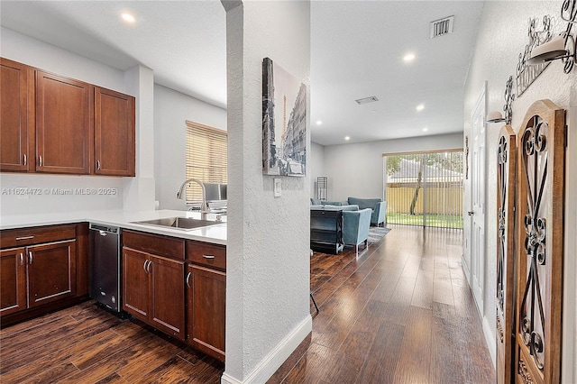 kitchen featuring sink and dark hardwood / wood-style floors