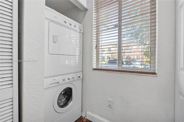 washroom with stacked washer / dryer