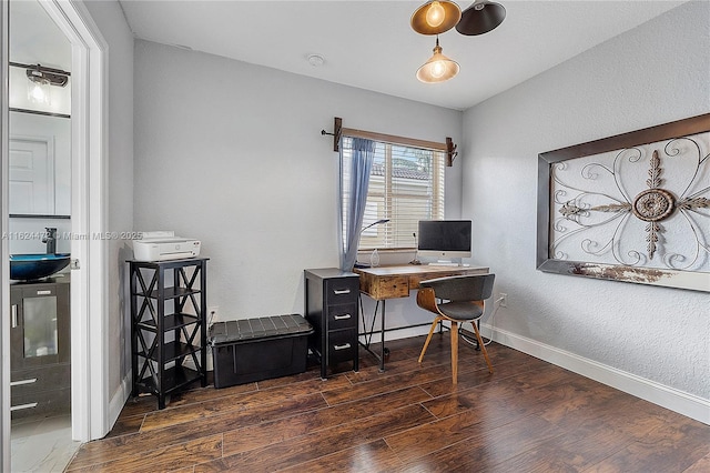 office space with sink and dark wood-type flooring