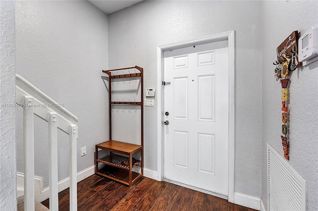 foyer entrance with dark hardwood / wood-style flooring