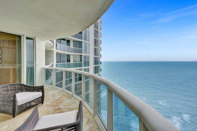 balcony featuring a water view