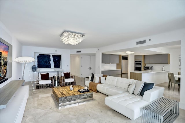 living room with a notable chandelier