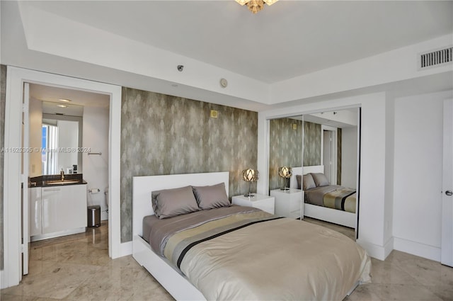 tiled bedroom featuring sink