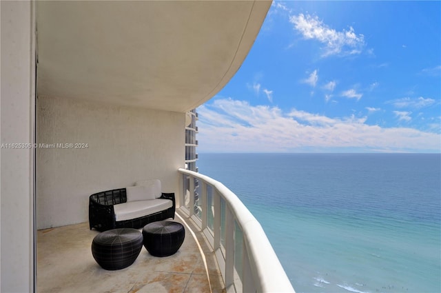 balcony featuring a water view