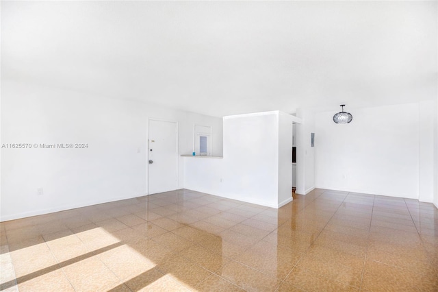 empty room featuring tile patterned floors