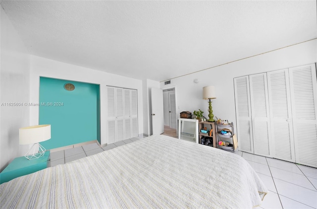 tiled bedroom with two closets