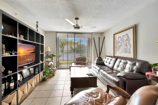 tiled living room featuring a textured ceiling and ceiling fan