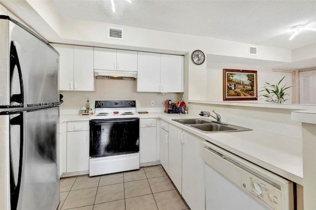 kitchen with sink, white cabinetry, a textured ceiling, and white appliances