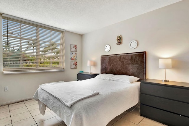 tiled bedroom with a textured ceiling