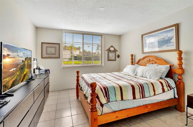 tiled bedroom featuring a textured ceiling