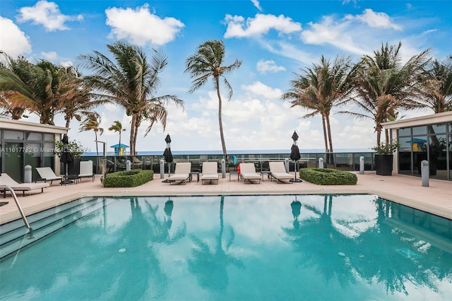 view of swimming pool featuring a patio area